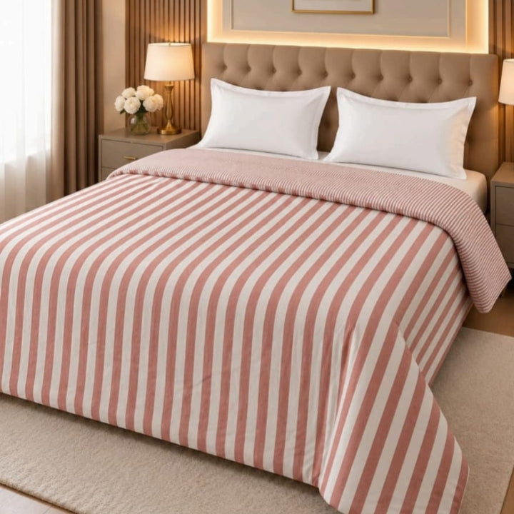 Milano imported super soft comforter by The Gharnish displayed on a bed with folded edges and plush fabric texture.