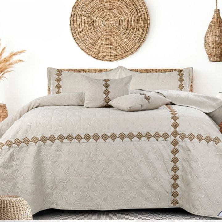 Embroidereied king size quilted bedcover set of 5 from The Gharnish, featuring intricate embroidery and plush bedding fabric.