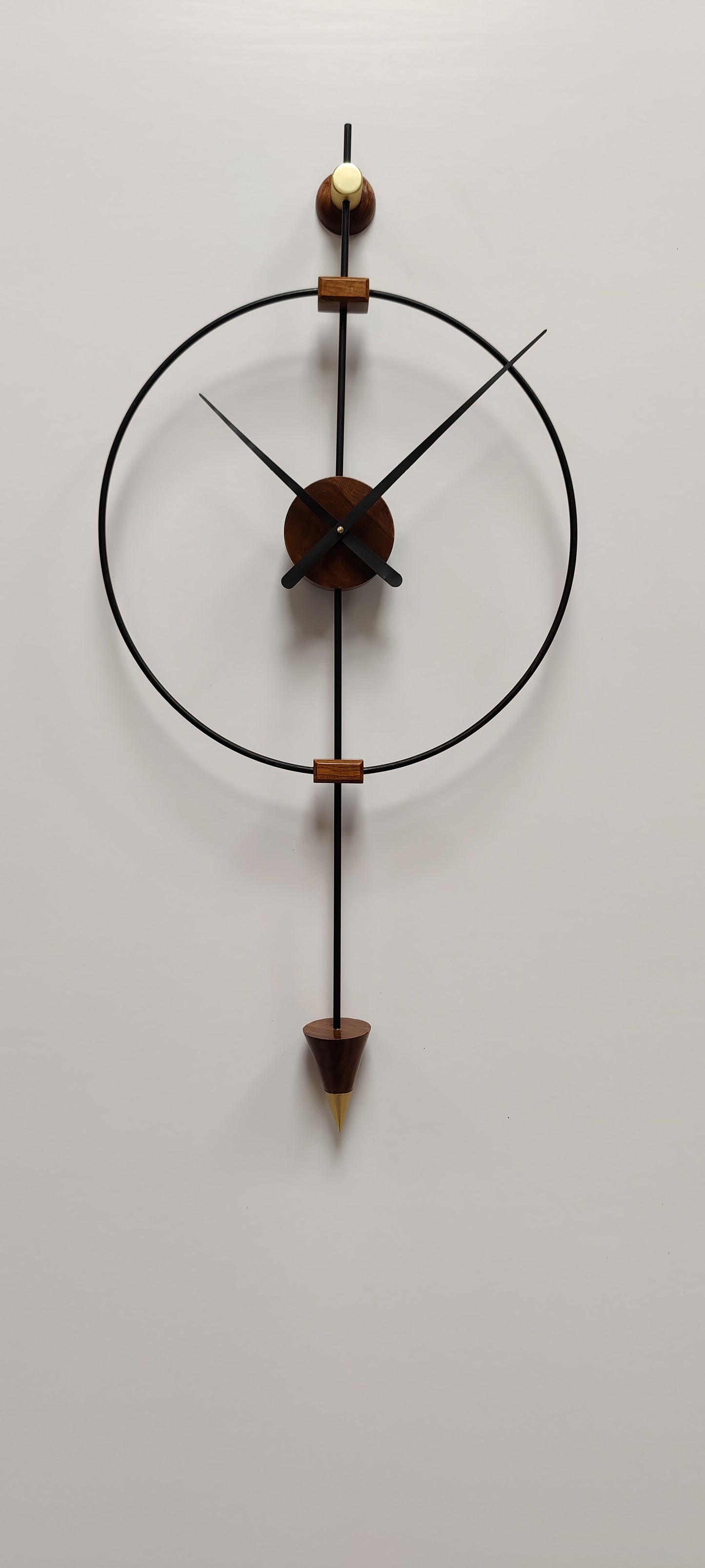 Modern large wooden wall clock by The Gharnish featuring a sleek design, suitable for living room decor and luxury interior style.