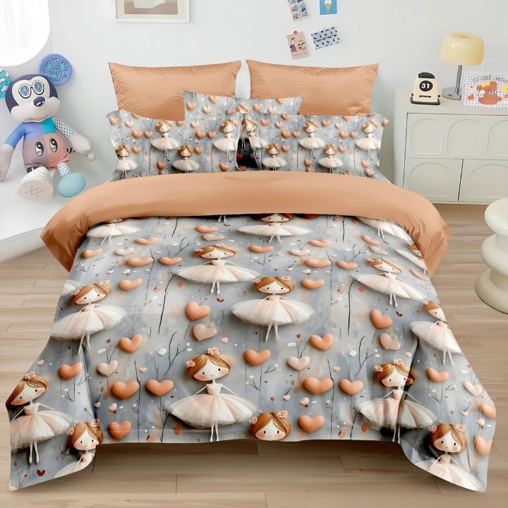 Bedding set with ballerina and heart pattern on a bed in a room.