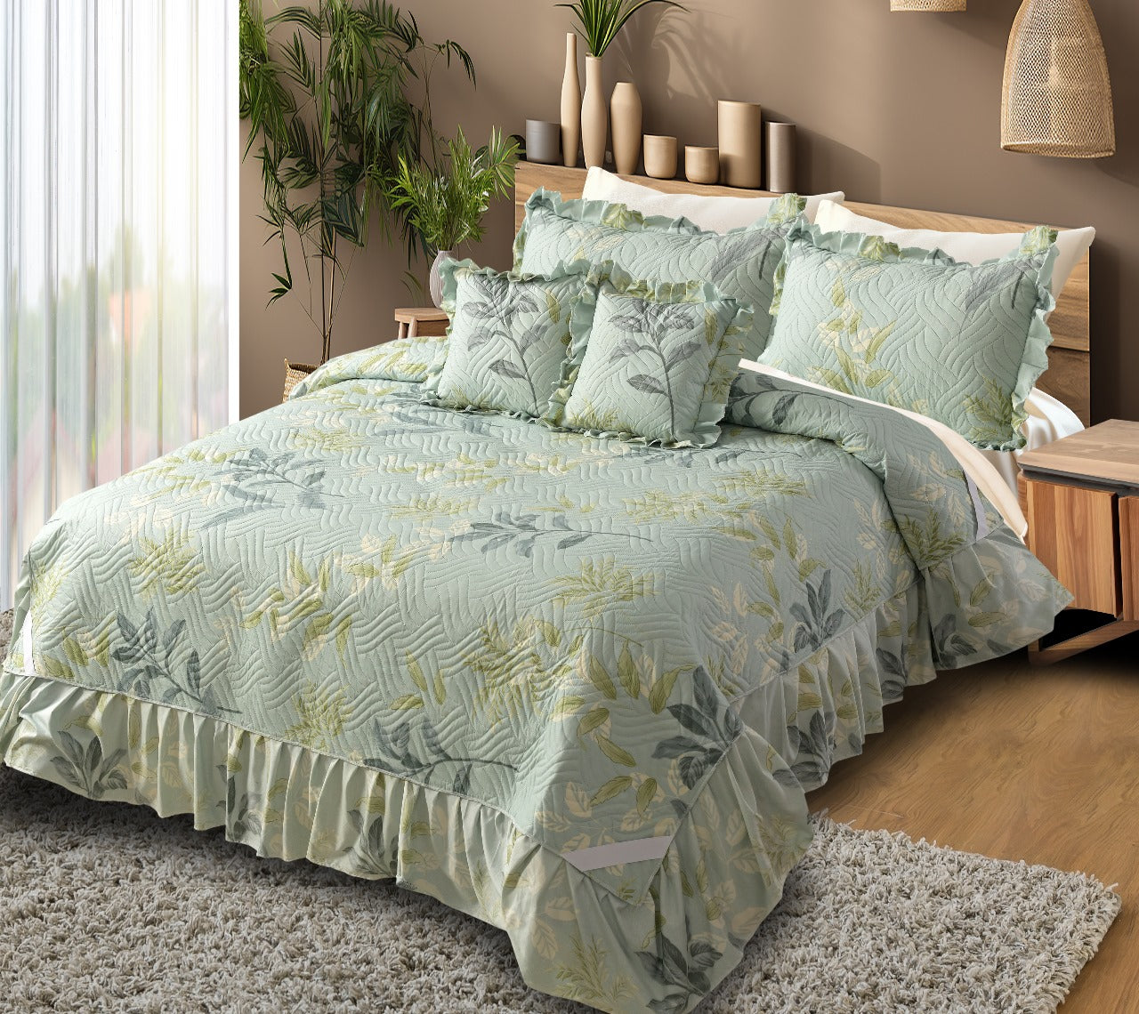 Bedroom with a bed covered in green floral bedding
