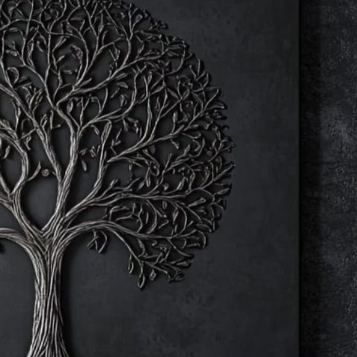 Black tree silhouette on a textured black background