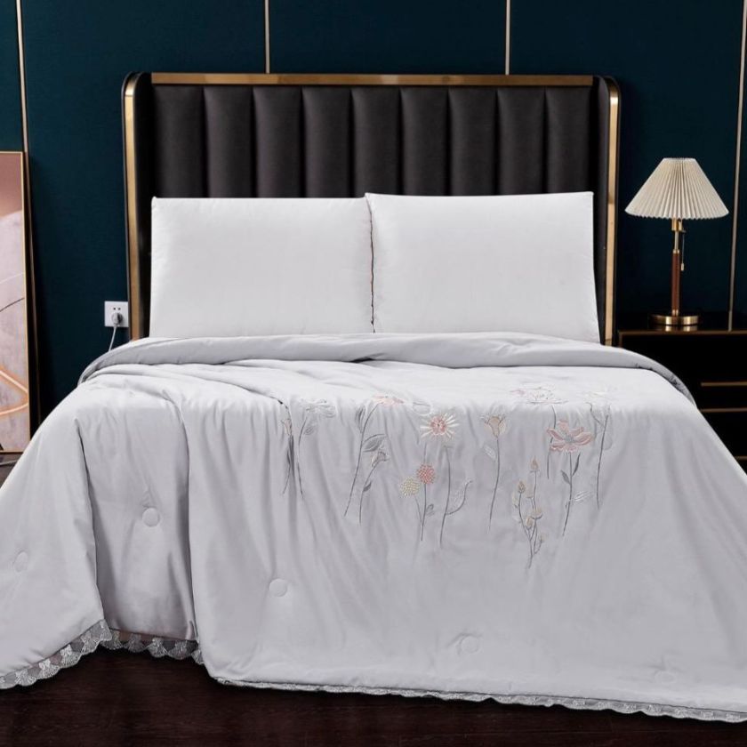 Solid Comforter, crafted with 100% super soft microfiber filling for a plush, cloud-like feel. Designed for both luxury and durability, it features exquisite embroidery and delicate lace detailing around the corners, adding a touch of elegance to your bedroom. Perfect for year-round coziness, this comforter blends warmth, style, and sophistication effortlessly.