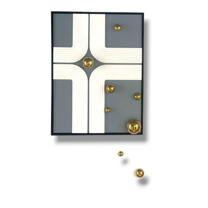 Decorative wall hook with geometric design and gold accents on a white background