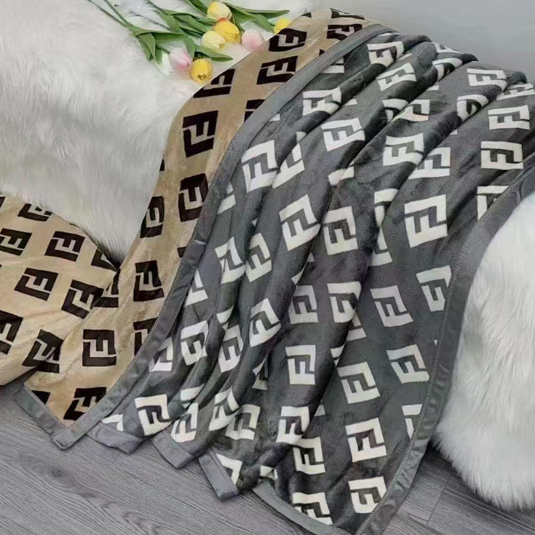 Folded patterned blanket with geometric design on a surface