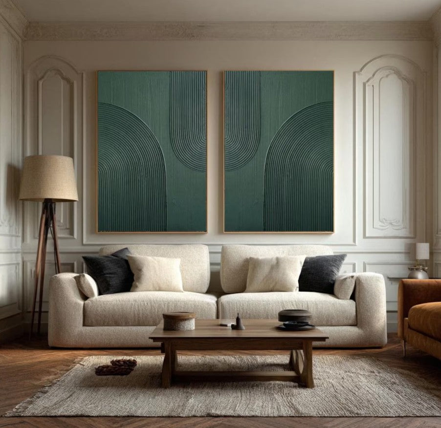 Modern living room with a beige sofa, wooden coffee table, and abstract green wall art.