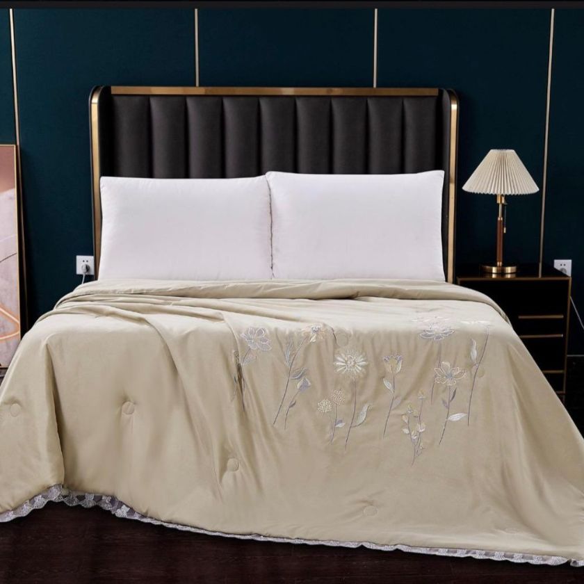 Solid Comforter, crafted with 100% super soft microfiber filling for a plush, cloud-like feel. Designed for both luxury and durability, it features exquisite embroidery and delicate lace detailing around the corners, adding a touch of elegance to your bedroom. Perfect for year-round coziness, this comforter blends warmth, style, and sophistication effortlessly.