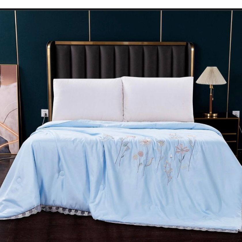 Solid Comforter, crafted with 100% super soft microfiber filling for a plush, cloud-like feel. Designed for both luxury and durability, it features exquisite embroidery and delicate lace detailing around the corners, adding a touch of elegance to your bedroom. Perfect for year-round coziness, this comforter blends warmth, style, and sophistication effortlessly.