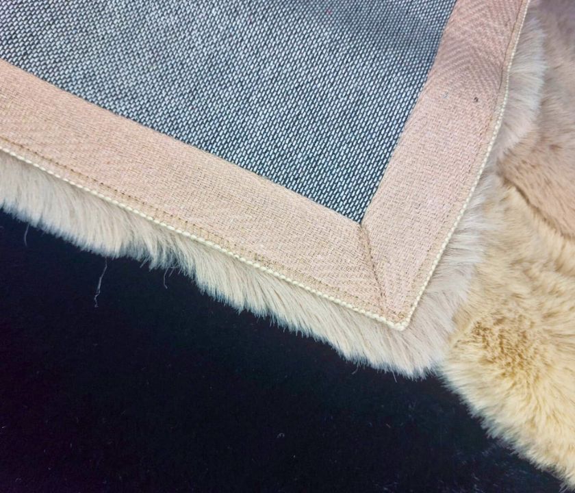 This Carpet made from high-quality faux rabbit fur, which offers an incredibly soft and plush texture. This material mimics the feel of real rabbit fur, providing a luxurious and cozy touch to your bedroom or any other area of your home.