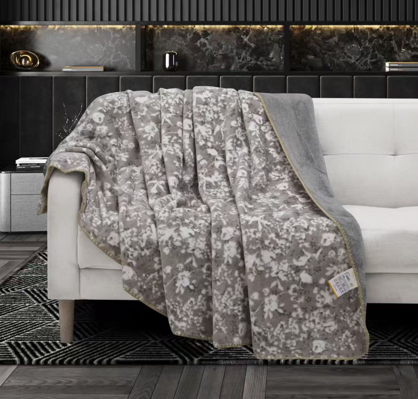 Lightweight The Gharnish Premium AC blanket in soft fabric, shown folded with a subtle textured design.