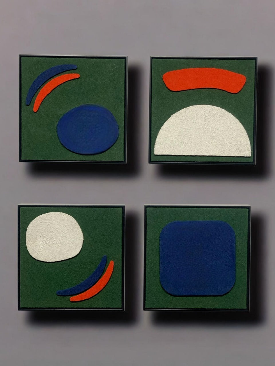 Four abstract art pieces with geometric shapes on a green background