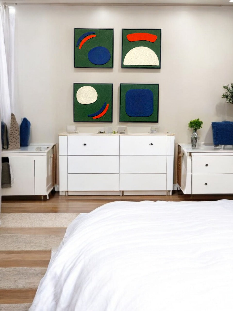 Modern bedroom with white furniture and abstract wall art