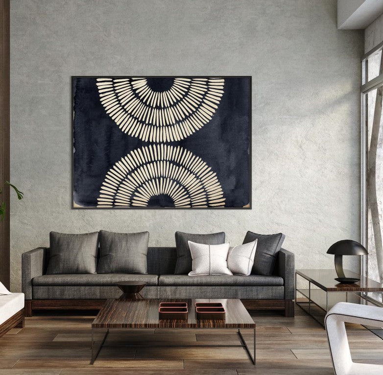 Modern living room with a gray sofa, abstract wall art, and wooden coffee table.