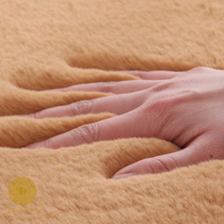 This Carpet made from high-quality faux rabbit fur, which offers an incredibly soft and plush texture. This material mimics the feel of real rabbit fur, providing a luxurious and cozy touch to your bedroom or any other area of your home.