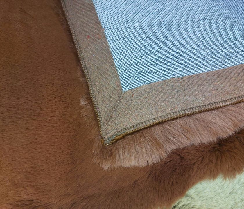 This Carpet made from high-quality faux rabbit fur, which offers an incredibly soft and plush texture. This material mimics the feel of real rabbit fur, providing a luxurious and cozy touch to your bedroom or any other area of your home.