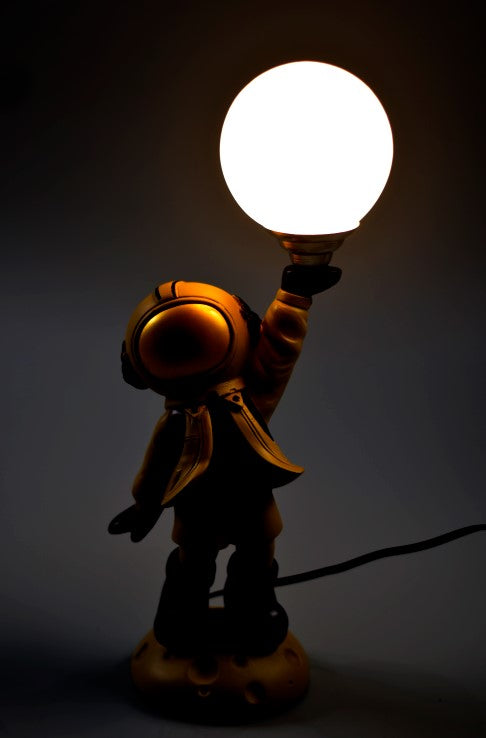 Polyresin Astronaut Holding Bulb - The Gharnish - A Unit of Satkala Creations