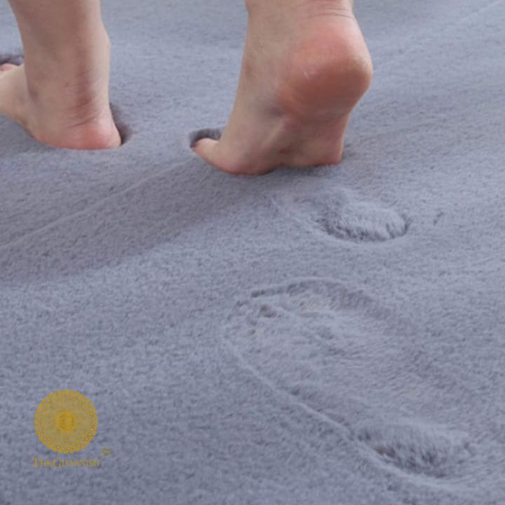 This Carpet made from high-quality faux rabbit fur, which offers an incredibly soft and plush texture. This material mimics the feel of real rabbit fur, providing a luxurious and cozy touch to your bedroom or any other area of your home.
