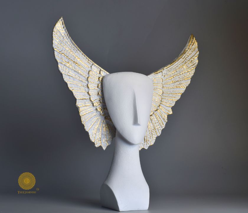 Black Flying Face Statue by The Gharnish, abstract figurine with a modern, artistic design of a flying face sculpture.