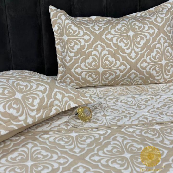 Cally Lilly Premium Quilted Bedding Set by The Gharnish features floral patterns on soft, comfortable bedding for a cozy bedroom look.