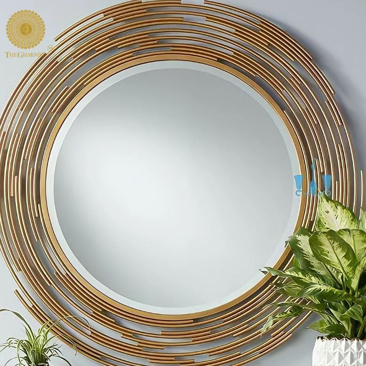 Gold layered pipe wall mirror, 24-inch diameter, decorative wall mirror by The Gharnish, featuring a modern industrial design.