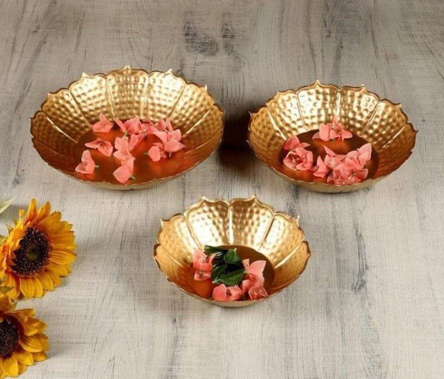 Set of three decorative floral Urli bowls by The Gharnish, featuring intricate patterns ideal for home decor.