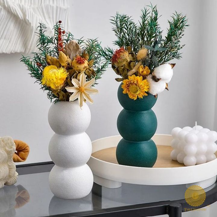 Elegant modern ceramic vase by The Gharnish, featuring an artistic design and smooth finish, ideal for contemporary home decor.