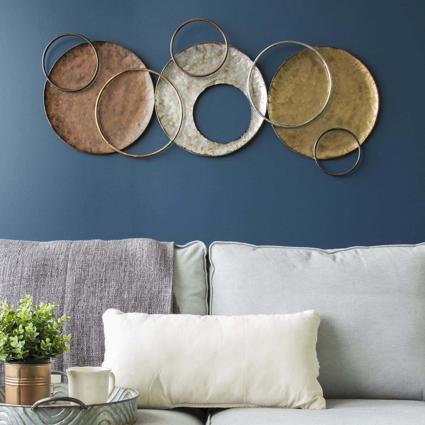 The Gharnish ring-designed circle wall art, 48x19 inches, featuring modern geometric patterns on a neutral background.
