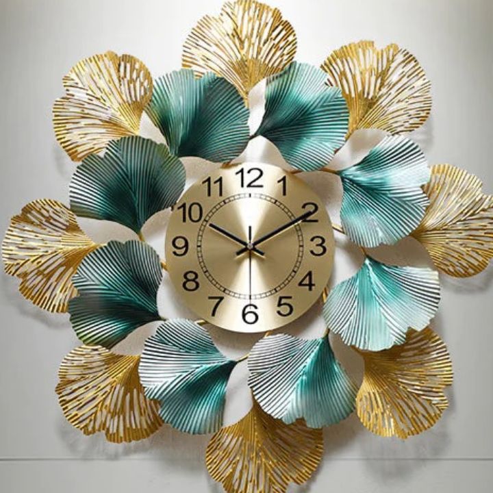 The Gharnish circular leaf metallic wall clock, 24 inches, with a modern leaf design and sleek metallic finish.