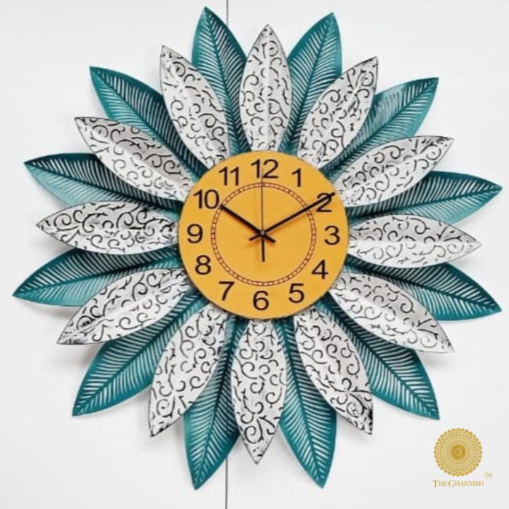 Metallic feather leaf wall clock by The Gharnish, 30-inch round clock with intricate feather design and metallic finish.