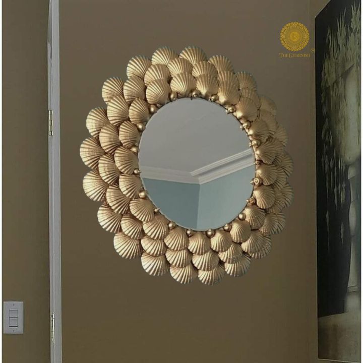 Elegant designer wall mirror by The Gharnish featuring a sleek, modern frame perfect for contemporary home decor.