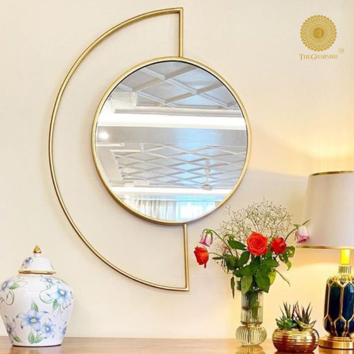Half Moon metallic wall mirror by The Gharnish, 27x35 inches, featuring a sleek, reflective surface and modern design.