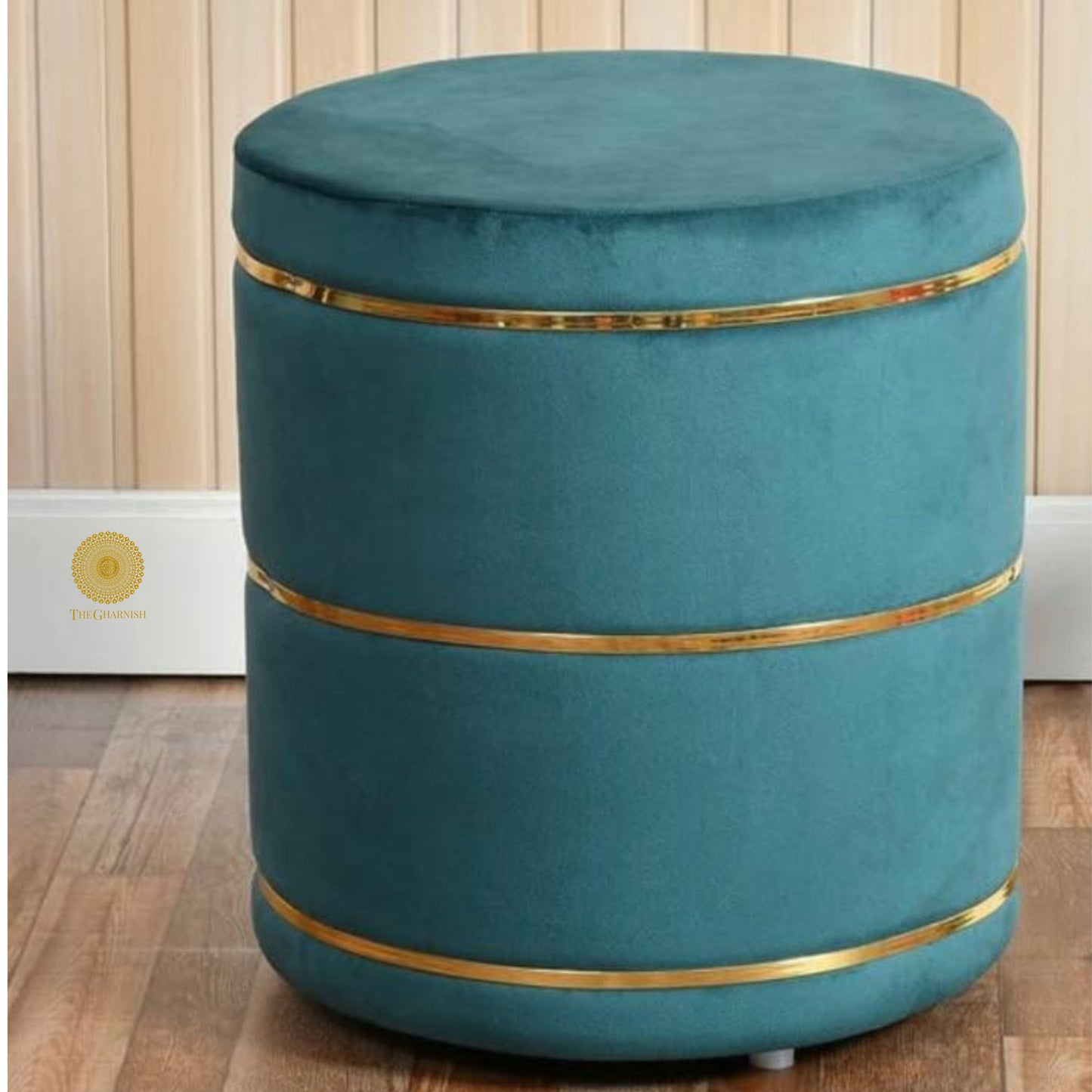 Light blue fabric ottoman stool by The Gharnish, versatile pouffe for living room or bedroom decor and seating.