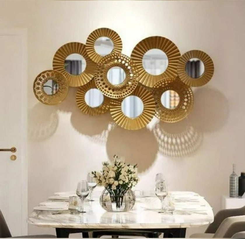 Metallic wall art featuring nine iron rings in a modern design, measuring 48 x 23 inches, by The Gharnish.