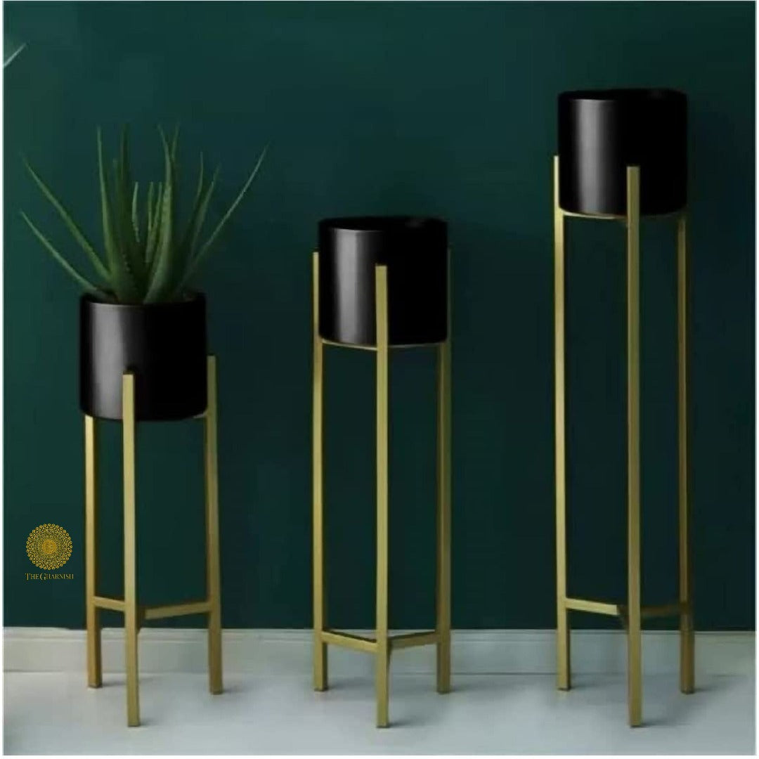 Set of three white planter pots with stands in 33, 25, and 18 inches by TheGharnish, ideal for indoor or outdoor plants.