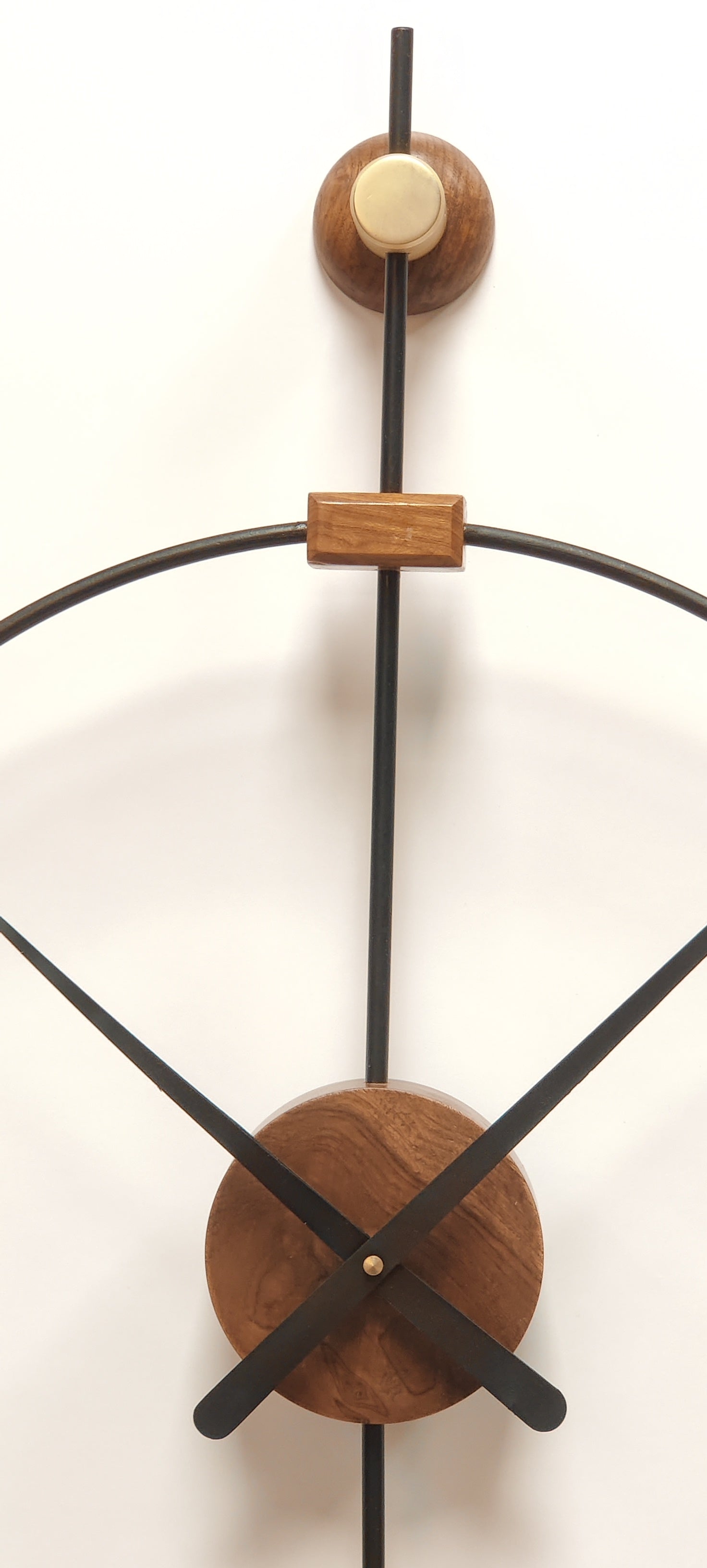 Modern large wooden wall clock by The Gharnish, decorative metal design, suitable for living room wall decor.