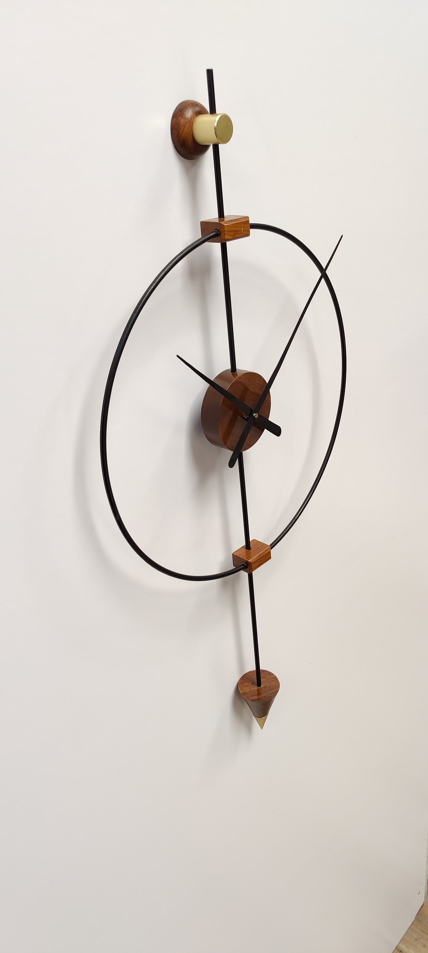 Large wooden wall clock by The Gharnish, modern metal design, decorative timepiece for living room wall.