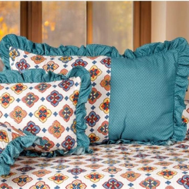 Serenity Bloom quilted 5-piece bedding set by The Gharnish featuring floral patterns and soft fabric for a cozy bedroom look.