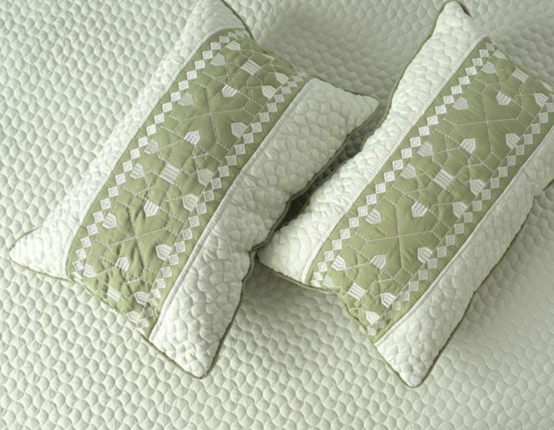 Luxury quilted embroidered bedding bedcover set by The Gharnish, five-piece set with intricate stitching and decorative embroidery.