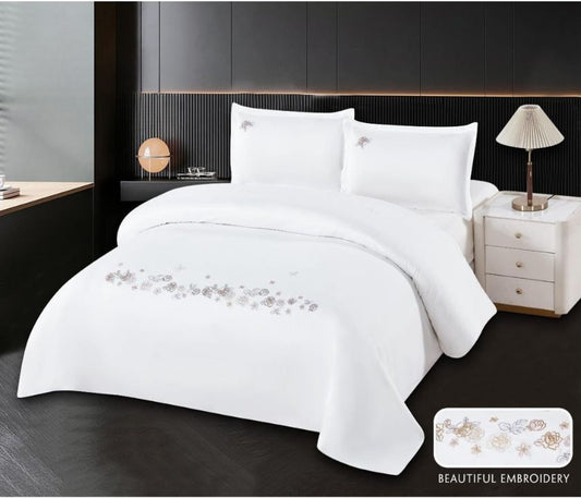 Set of 100% cotton embroidery bedding featuring detailed floral patterns, crafted by The Gharnish.