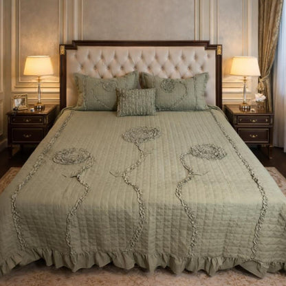 Ivory leaf handwork super designer king size quilted bedding bedcover by The Gharnish with intricate leaf embroidery and quilting details.