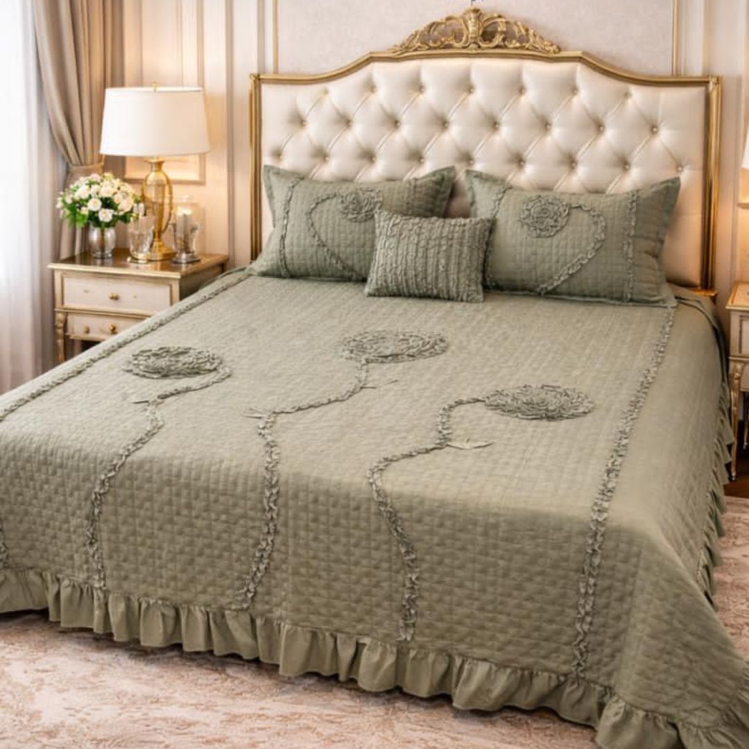 Ivory leaf design handwork king size quilted bedcover from The Gharnish, featuring intricate embroidery and a luxurious bedding style.