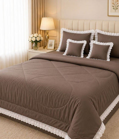 Luxury quilted king size bedcover set by The Gharnish, featuring a plush bedding design with matching pillow shams and intricate stitching.