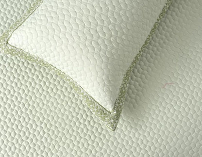 Luxury quilted embroidered bedcover set by The Gharnish, five-piece bedding ensemble with intricate embroidery and plush fabric.