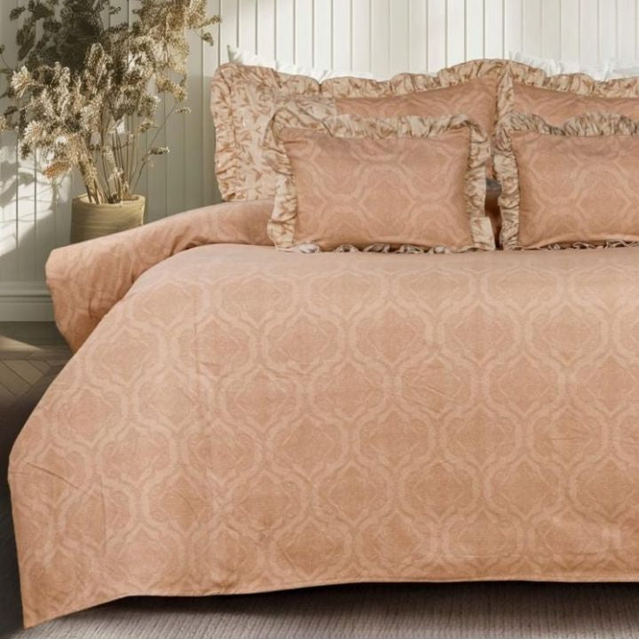 Serenity Bloom quilted bedding set by The Gharnish with five pieces, featuring floral patterns and soft pastel colors.