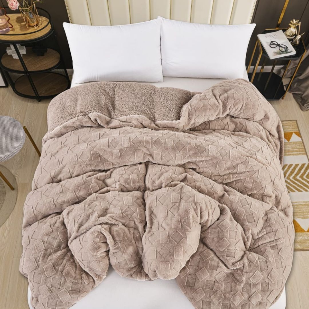 Luxury 2-in-1 rabbit fur and sherpa blanket and duvet cover from The Gharnish, showing plush textures and cozy all-season bedding.