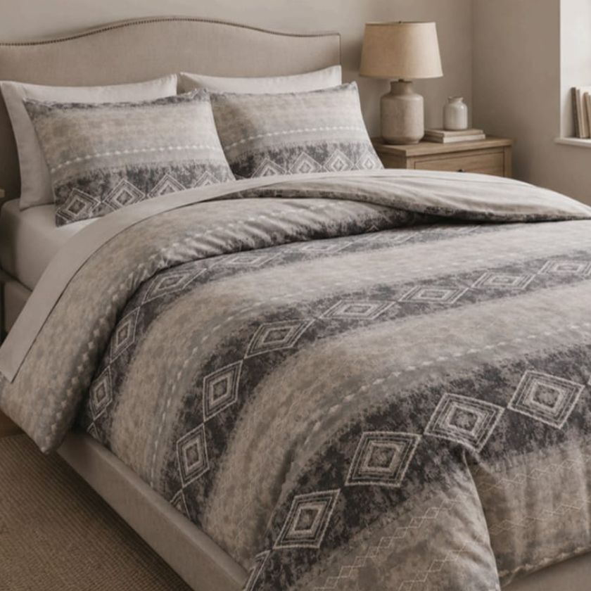 Ashwood Luxe Geometric Bedcover Set from The Gharnish, showcasing a modern bedding design with geometric patterns on a bed.