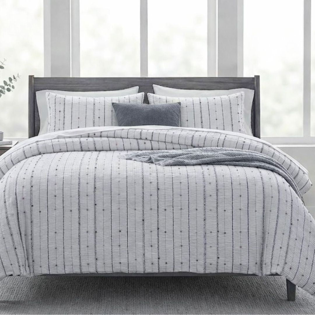 Turkish Super-Premium Tufted Cotton Blend Reversible Comforter Set with four bedding pieces, featuring tufted design and soft fabric.