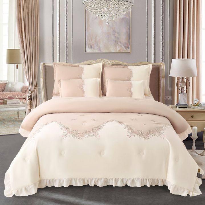 Regal Blush Aura Romantic embroidered luxury bedding set with comforter and bedsheets from The Gharnish, featuring intricate embroidery.