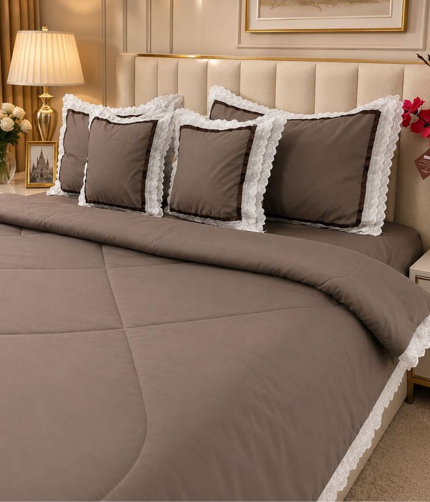 Luxurious quilted king size bedding set by The Gharnish with six pieces, featuring a plush, patterned bedcover and matching pillow shams.