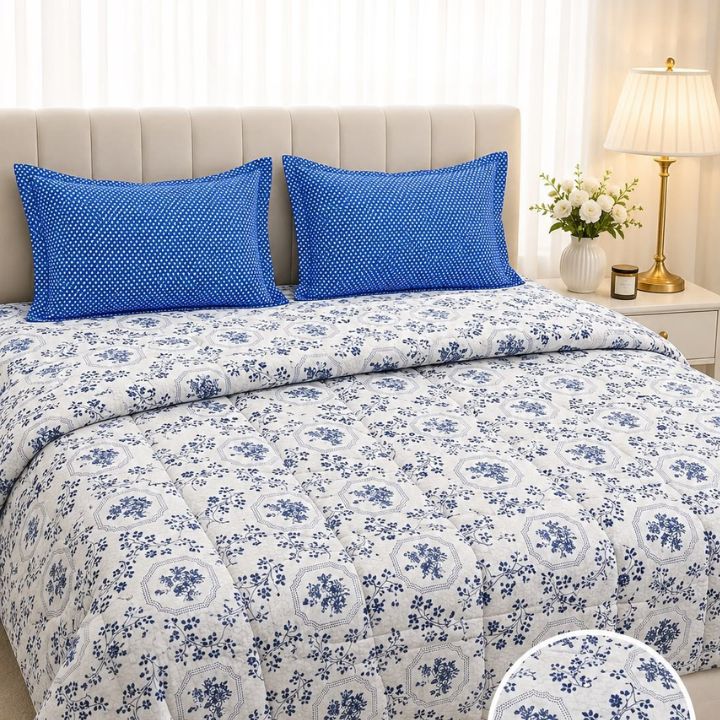 The Gharnish Boutique-Fit 4-piece king size comforter set with cozy, plush comforter and matching pillow shams on a bed.